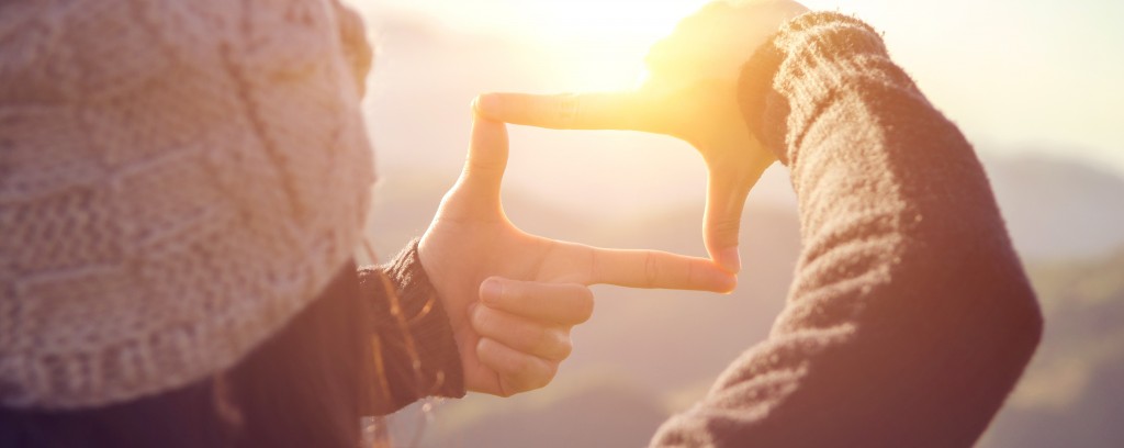 Close up of woman hands making frame gesture with sunrise on moutain, Female capturing the sunrise, Future planning, sunlight outdoor.